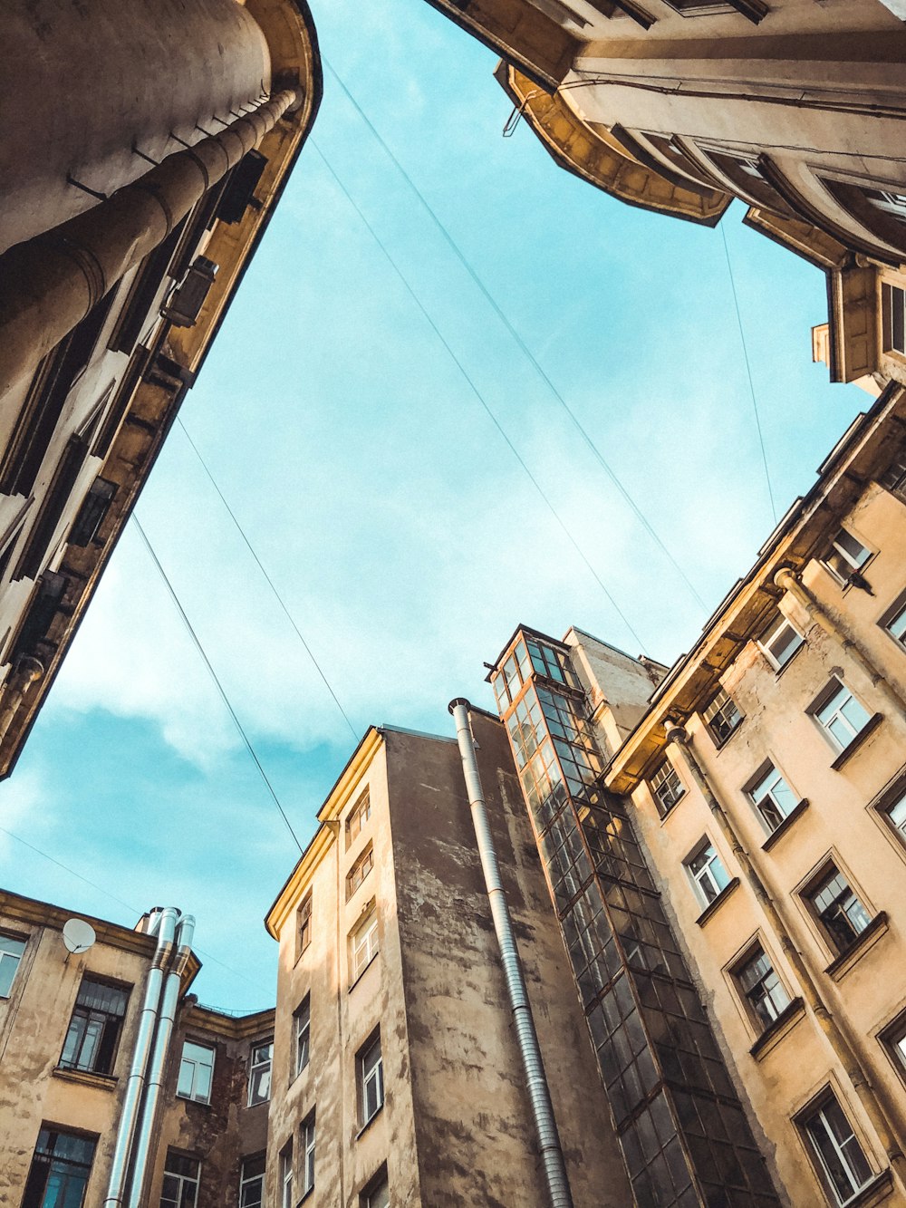 looking up at tall buildings in a city