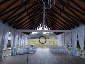 A serene christening ceremony held inside the cozy, rustic event space at Vineyard House Ventures.