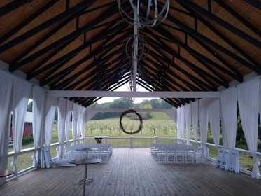 A serene christening ceremony held inside the cozy, rustic event space at Vineyard House Ventures.