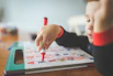 a young child is drawing on a piece of paper