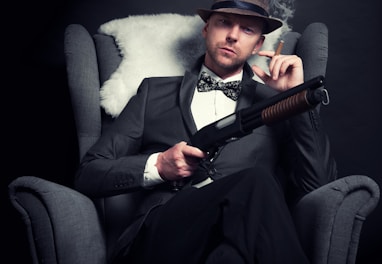 a man in a tuxedo smoking a cigarette