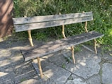 Rustic wooden bench with smooth finish and sturdy legs.
