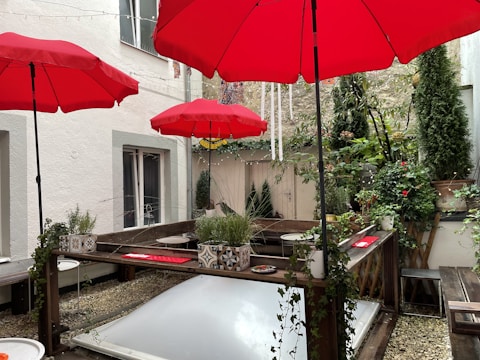 An outdoor patio shielded from rain with a protective layer.