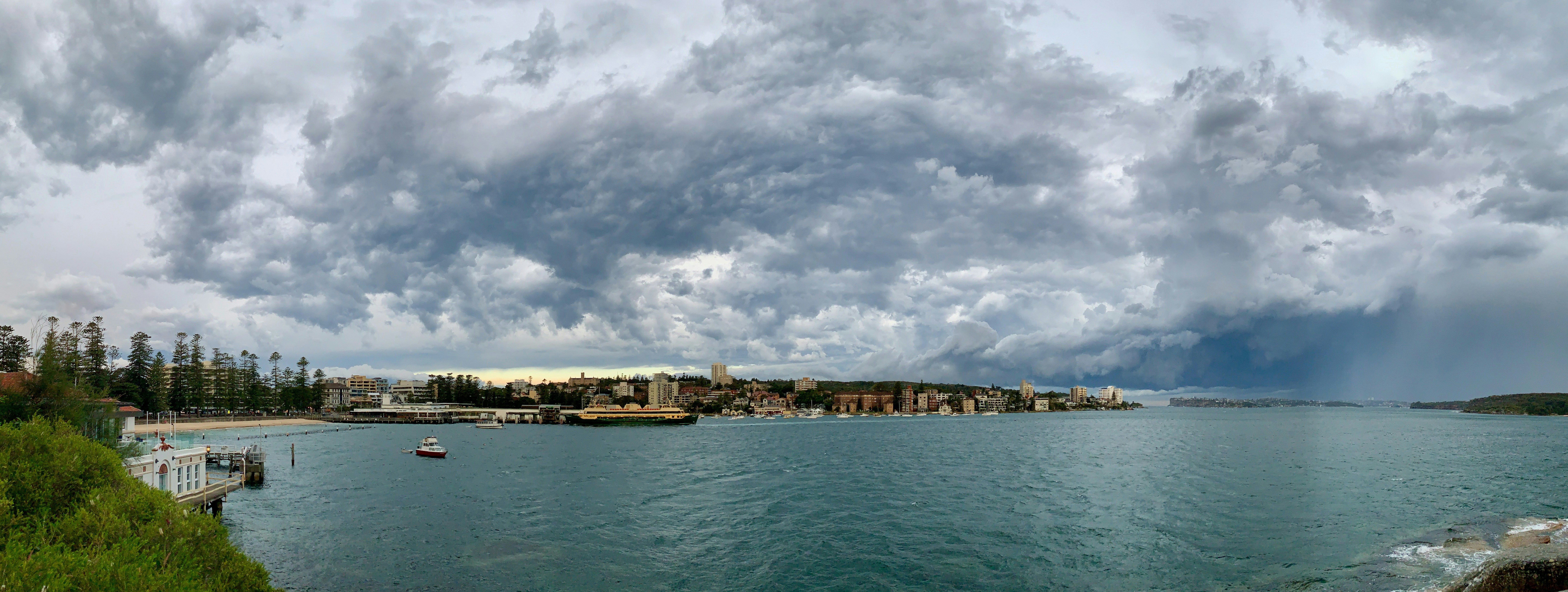 a large body of water under a cloudy sky