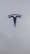 A sleek, metallic logo in the shape of a T sits prominently against a smooth, white background, conveying a sense of modern elegance and sophistication.