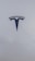 A sleek, metallic logo in the shape of a T sits prominently against a smooth, white background, conveying a sense of modern elegance and sophistication.