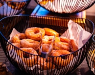 A basket overflowing with colorful pan dulce, dusted lightly with sugar.