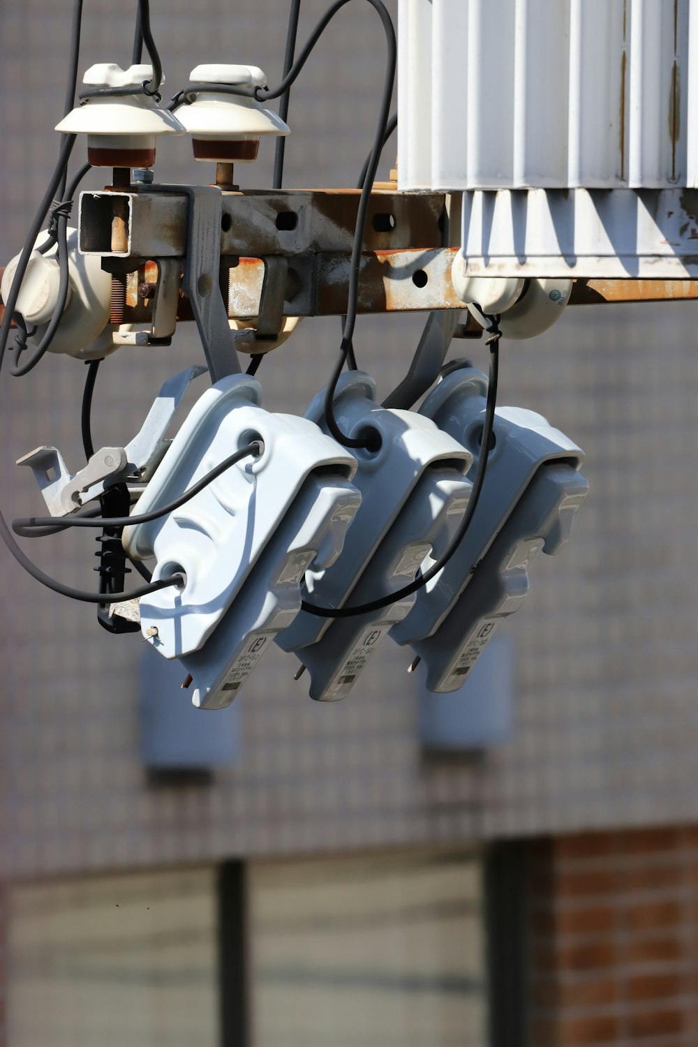 a bunch of wires that are hanging from a pole