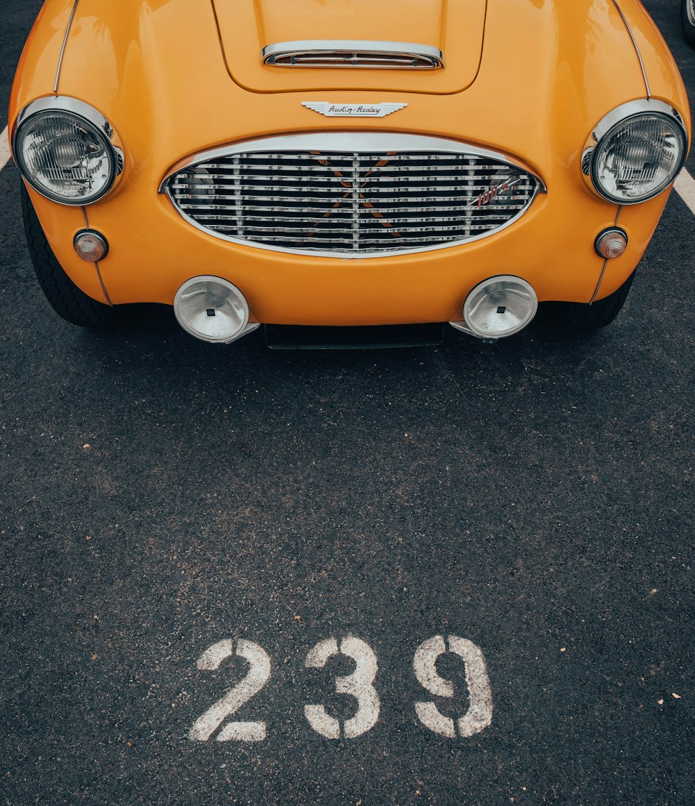 a yellow car parked in a parking lot