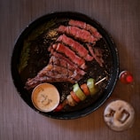 a plate of meat and vegetables on a table