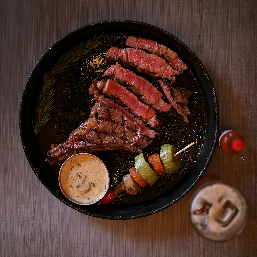 a plate of meat and vegetables on a table