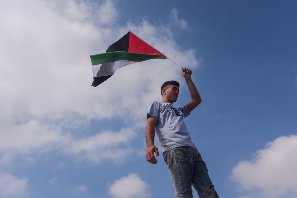 a man flying a kite in the sky