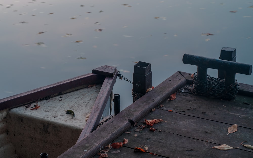 a boat tied to a dock in a body of water