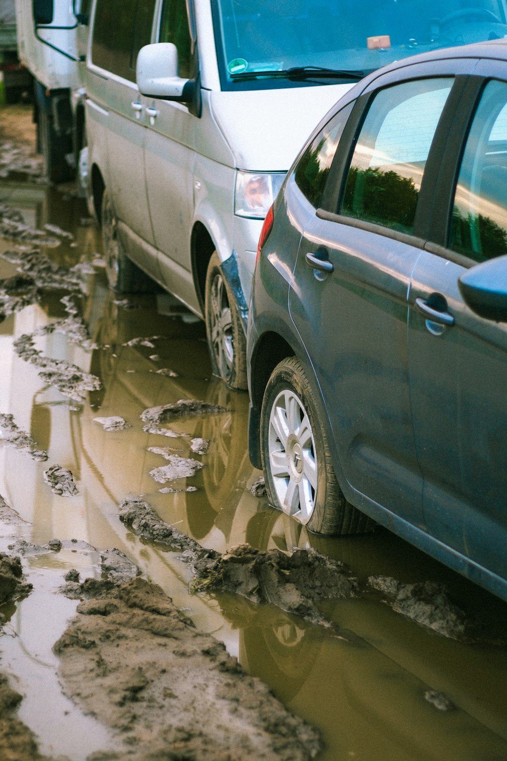 a car is parked in a puddle of water