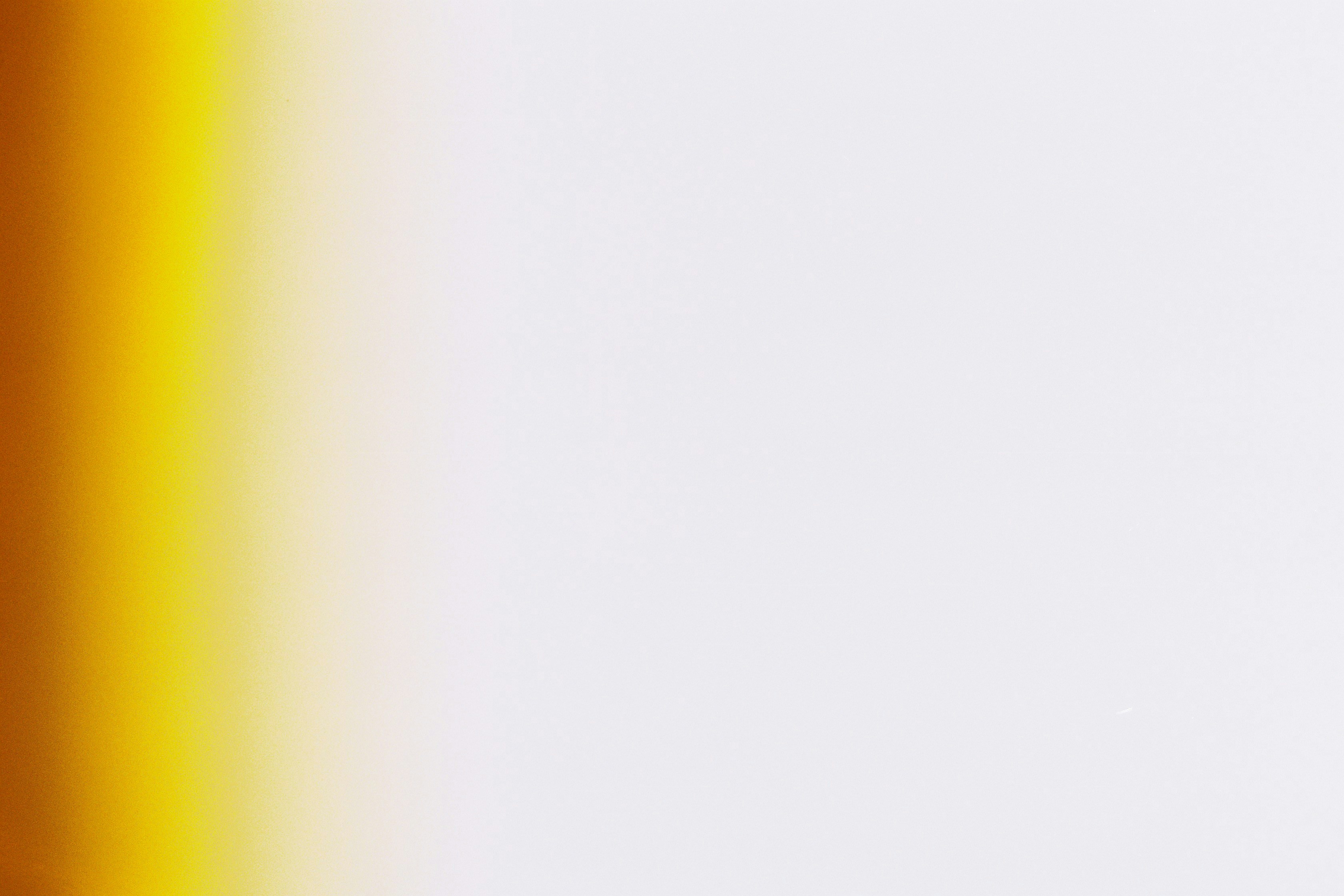 a vase with a flower in it sitting on a table