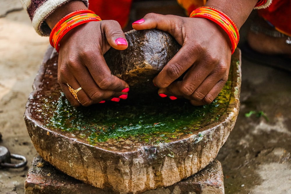 a close up of a person holding something in their hands