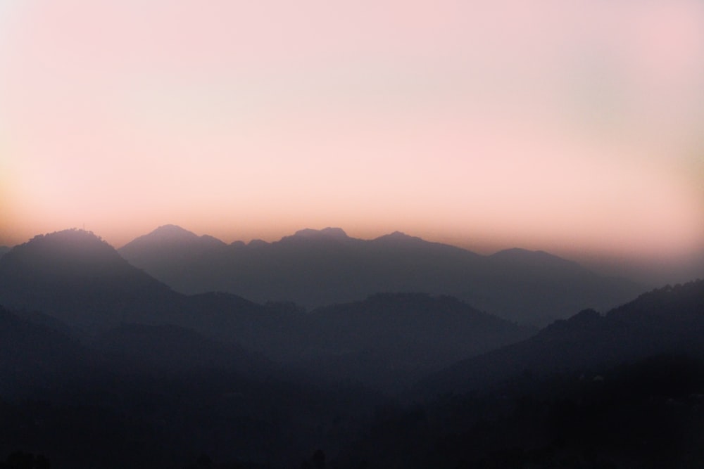 a view of a mountain range at sunset