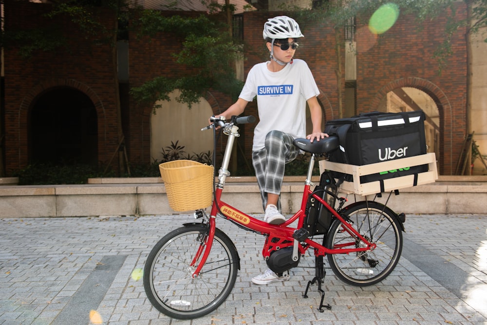 a man riding a bike with a basket on the back of it