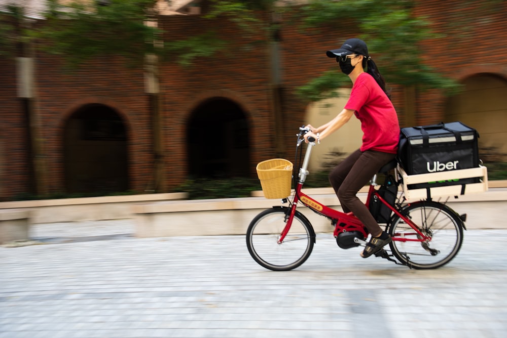 a person riding a bike with a basket on the back