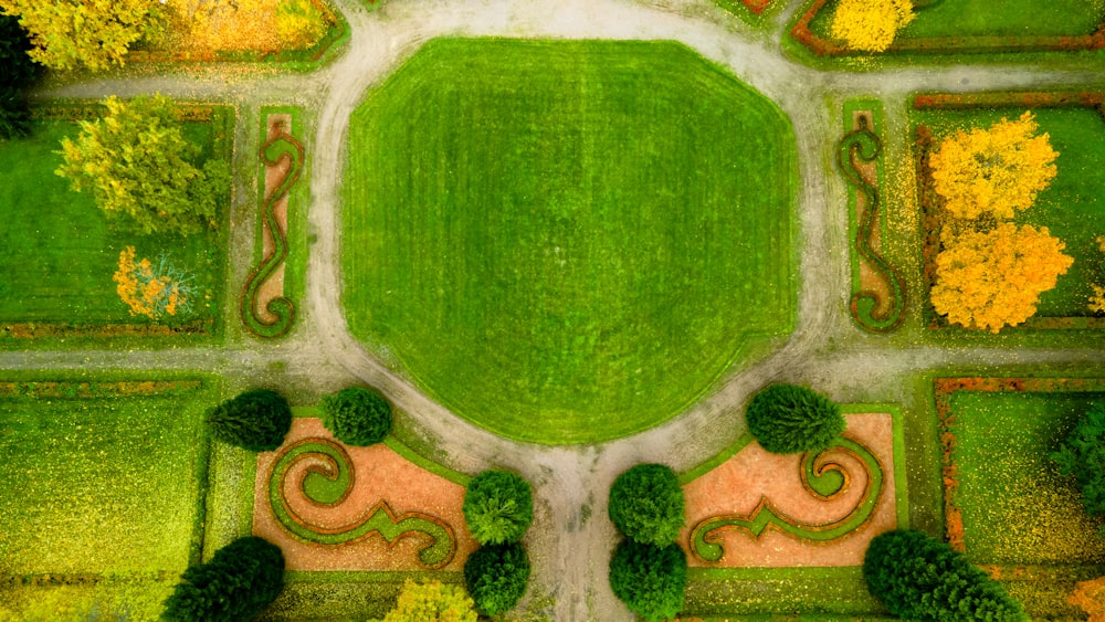 an aerial view of a park with a green lawn