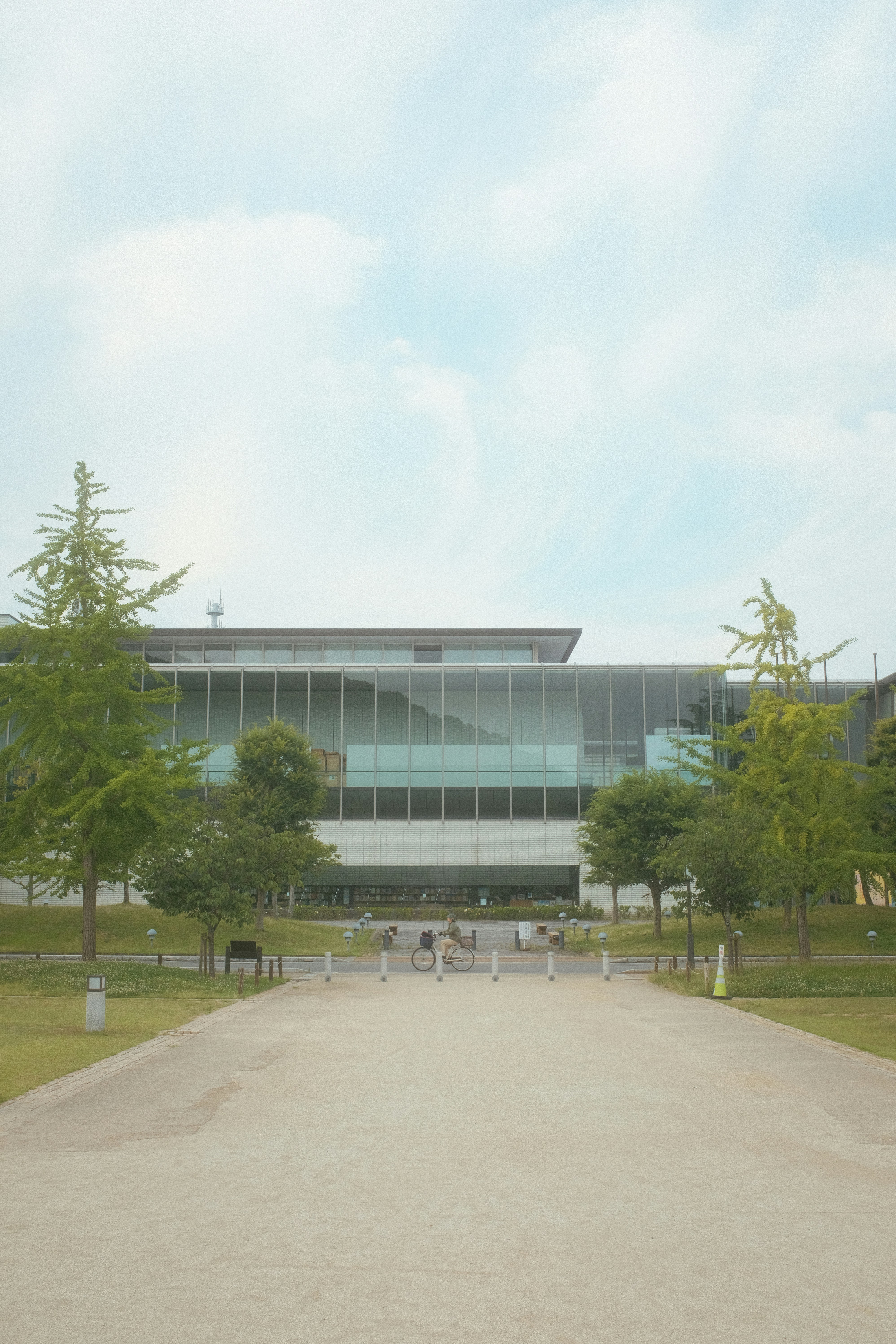 a large building with a lot of trees in front of it