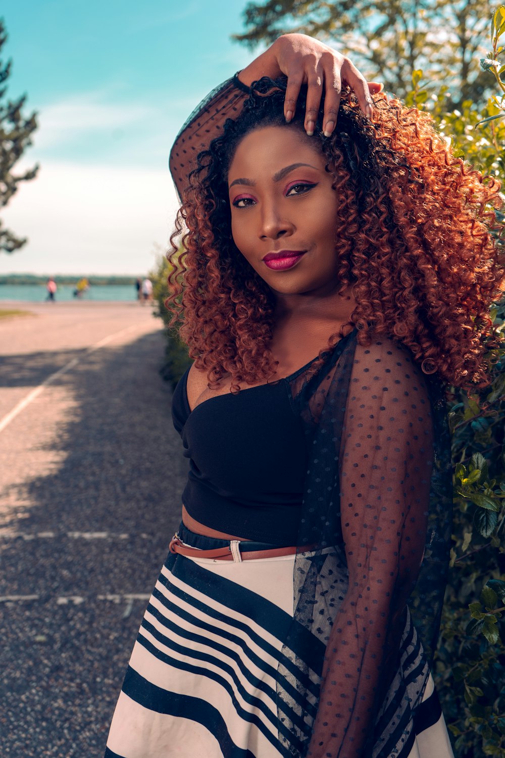 a woman with red hair is posing for a picture