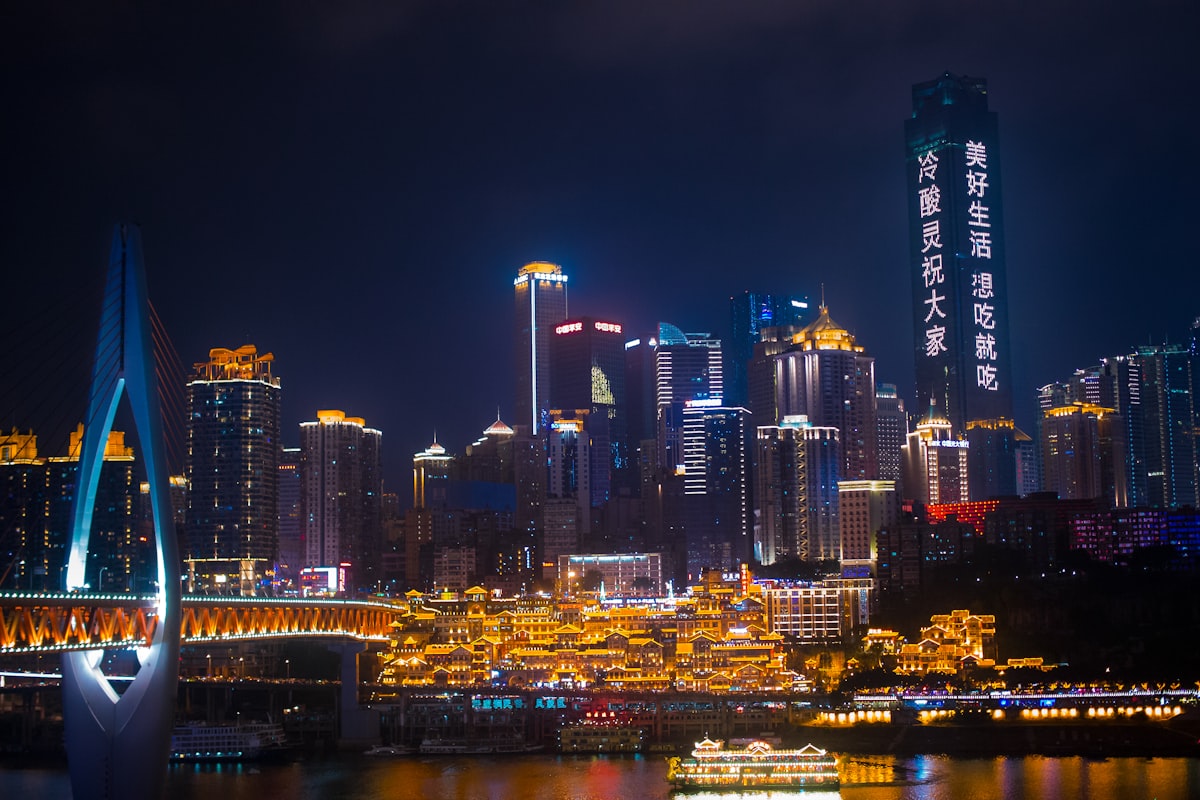 Chongqing city skyline at night with neon lights and bridge