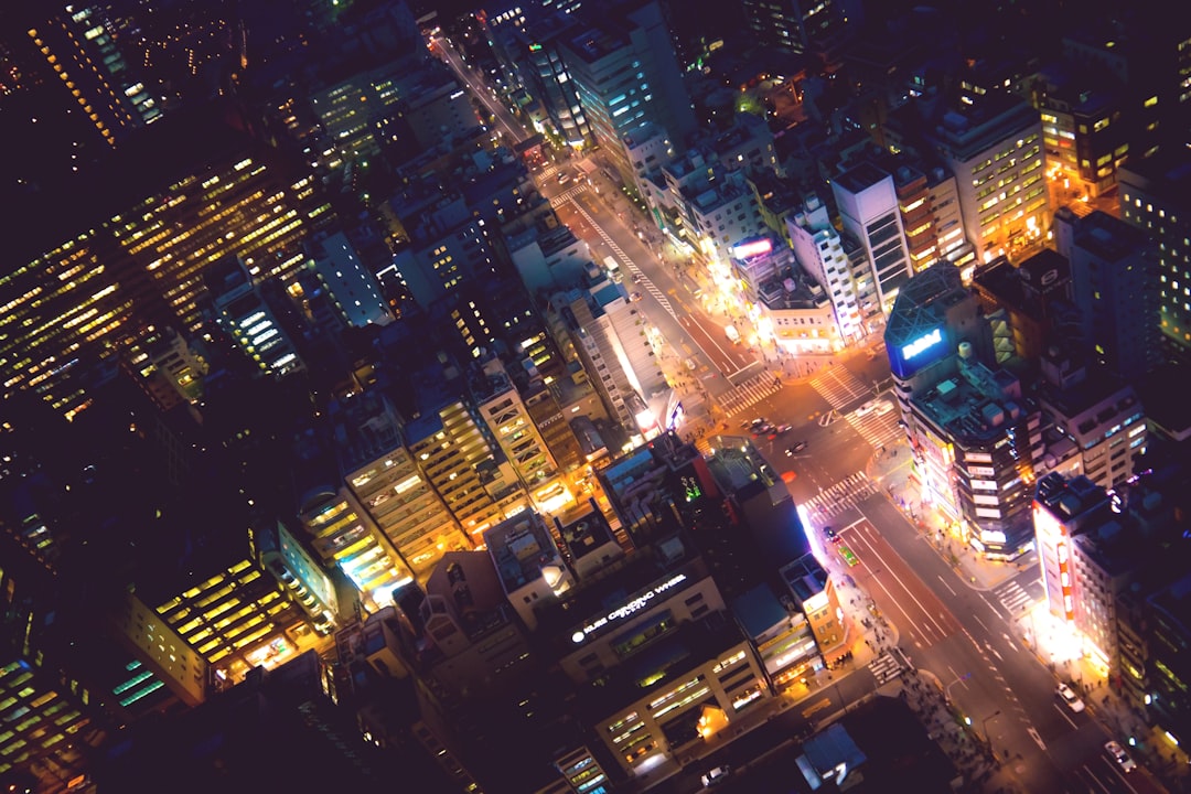an aerial view of a city at night,