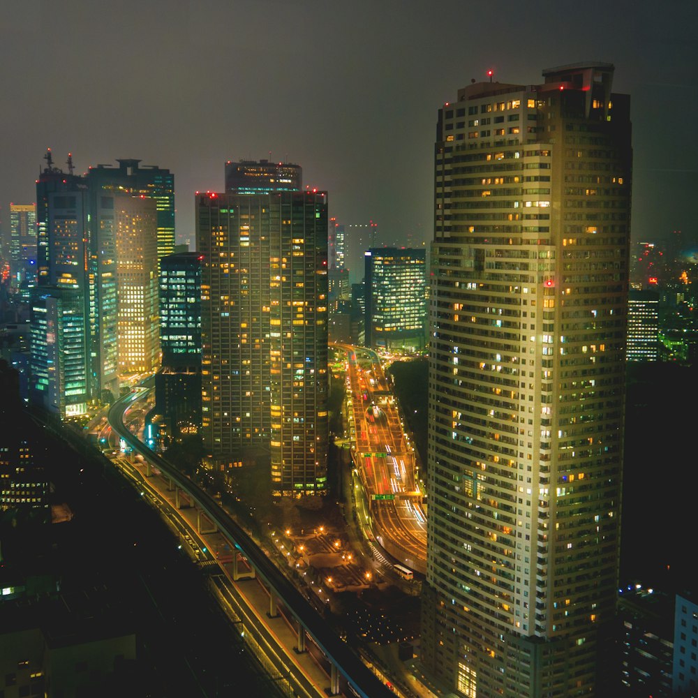 a view of a city at night from the top of a building