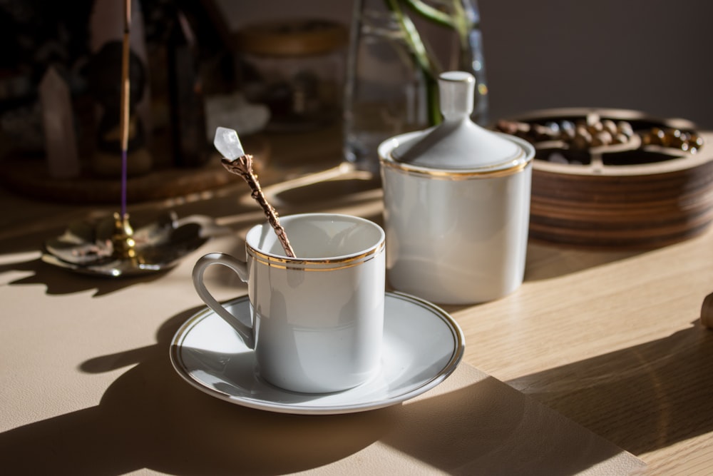 a cup and saucer sitting on a table