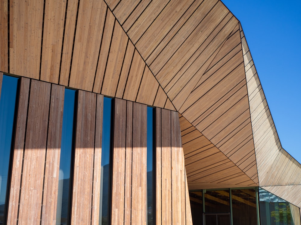 a building that has a curved wooden wall