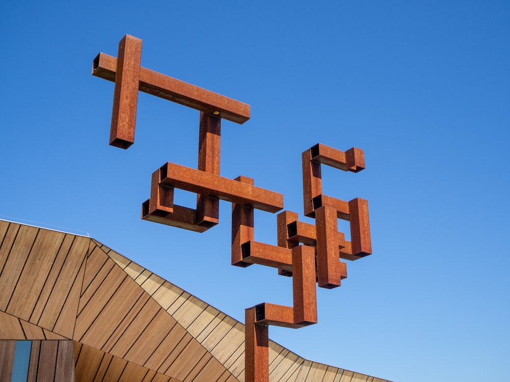 a sculpture of crosses on top of a building