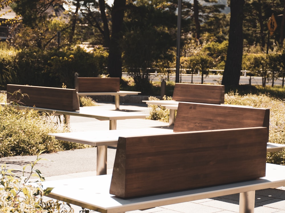 a row of wooden benches sitting next to each other