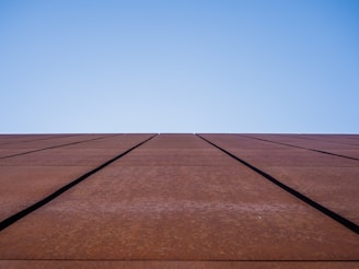 a very tall building with a sky in the background