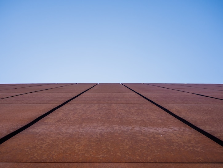 a very tall building with a sky in the background