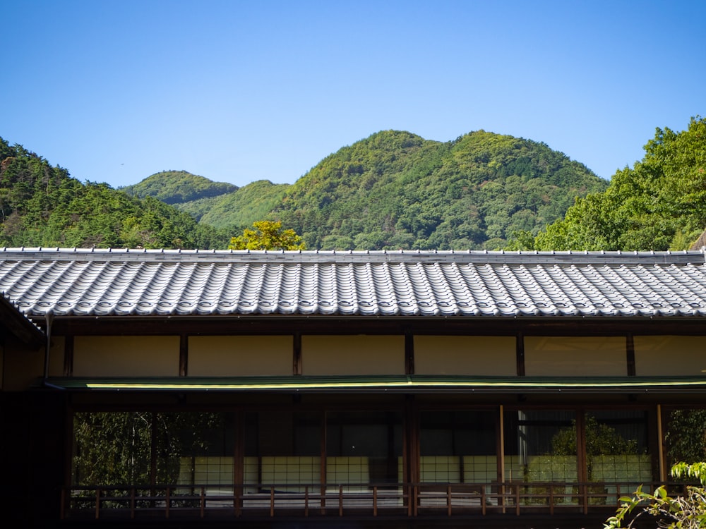 a building with a mountain in the background