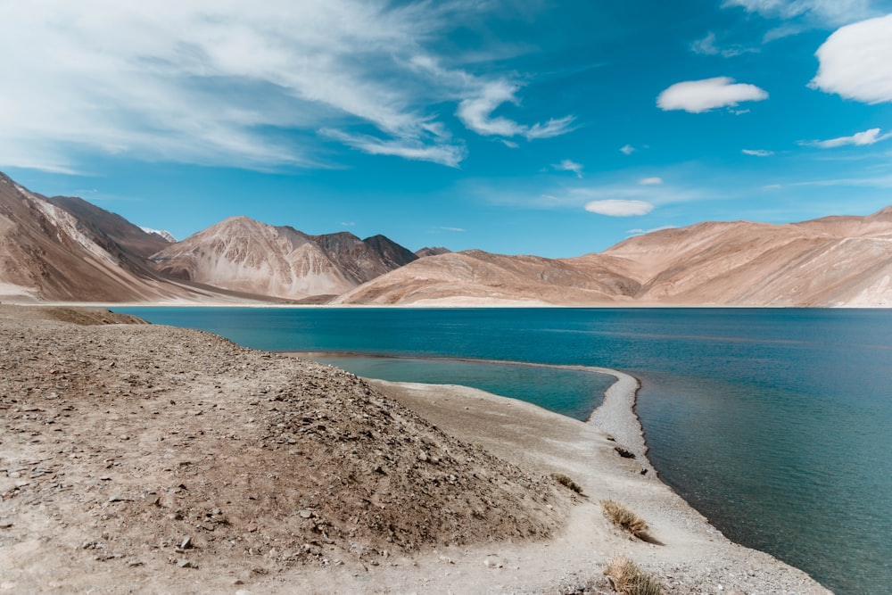 a large body of water surrounded by mountains