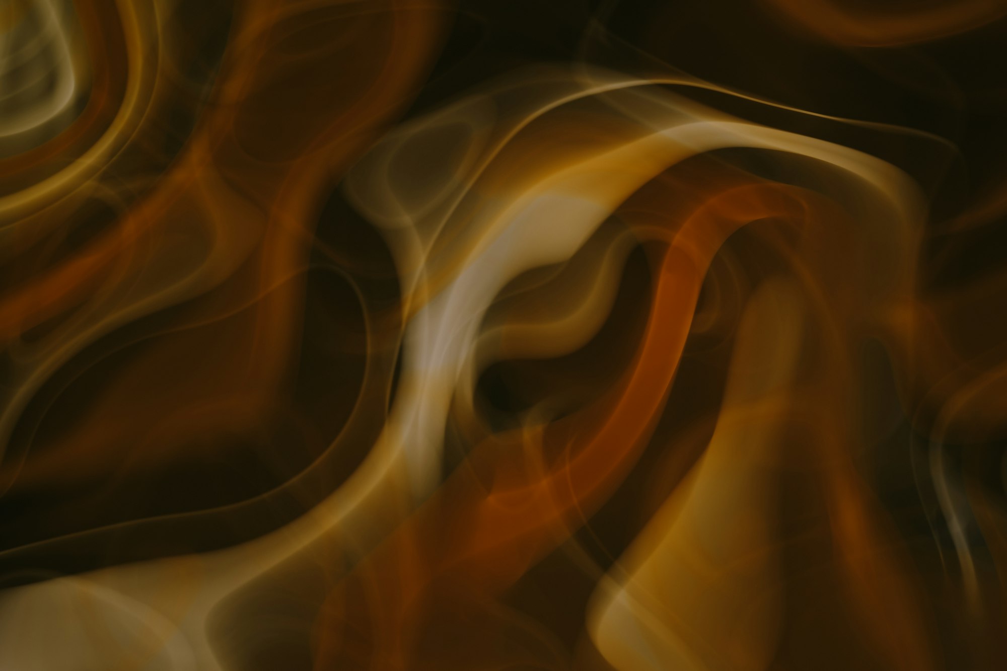 Image of fire swirling around, caught in slow shutter speed via camera. 