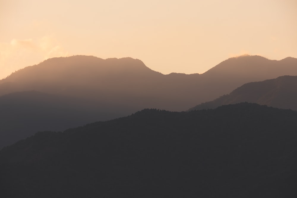 a view of a mountain range at sunset