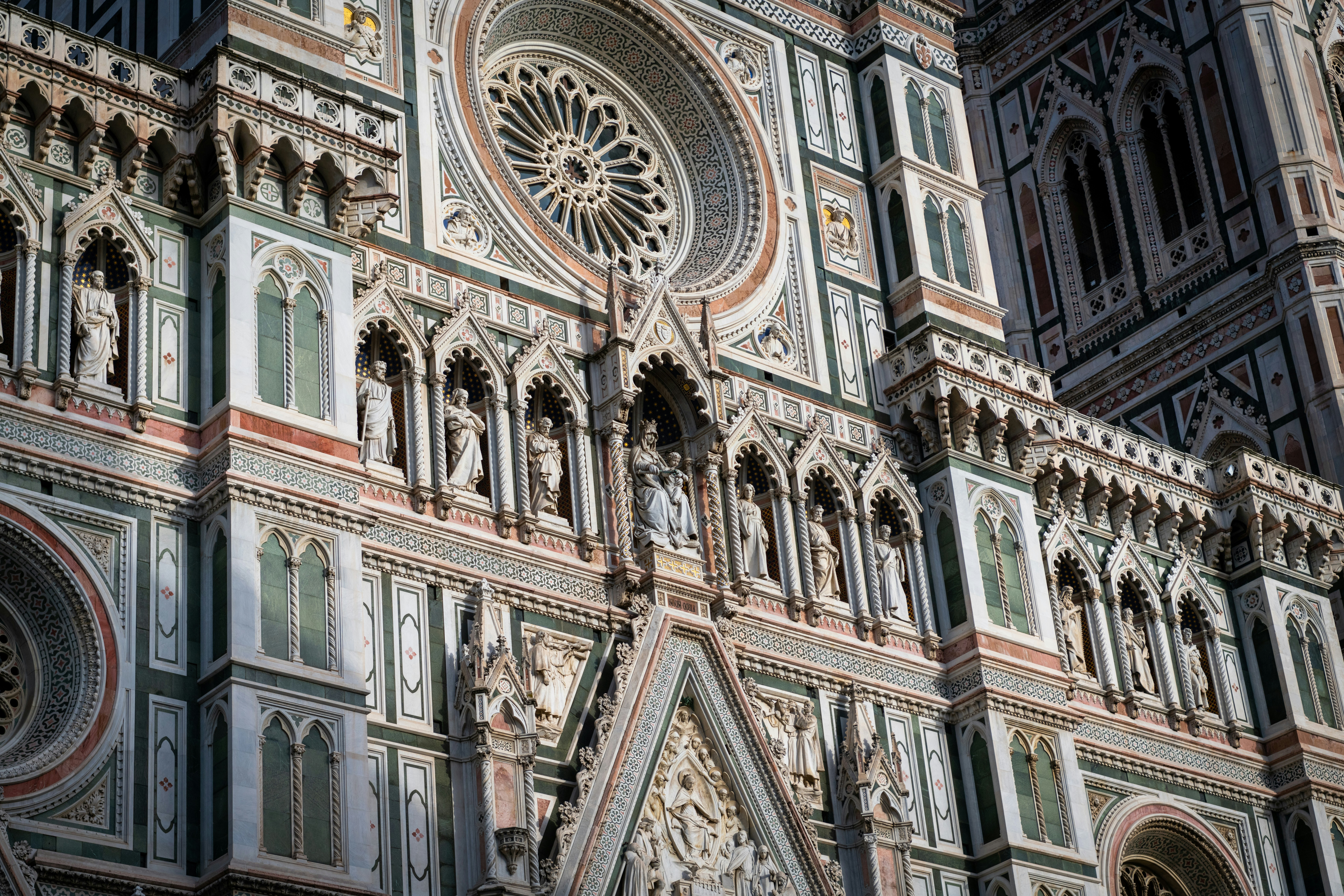 A large cathedral with a clock on the side of it