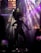 A silhouette of a dancer under colorful stage lights, creating an energetic and vibrant atmosphere.