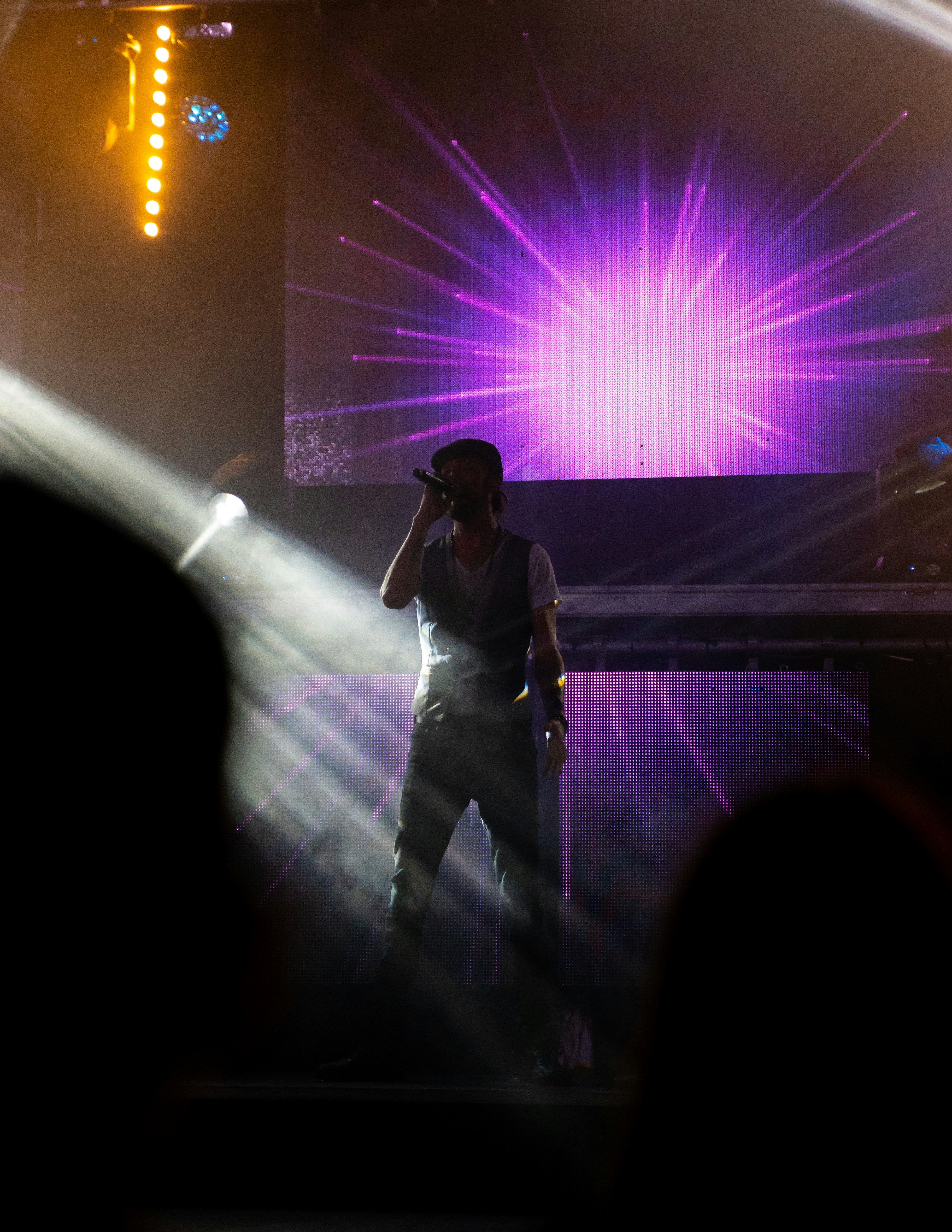 a man standing on a stage with a microphone