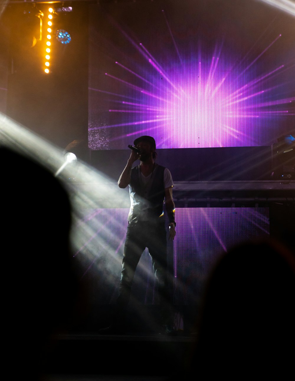 a man standing on a stage with a microphone