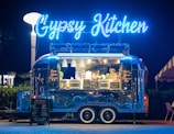 a food truck parked in front of a restaurant