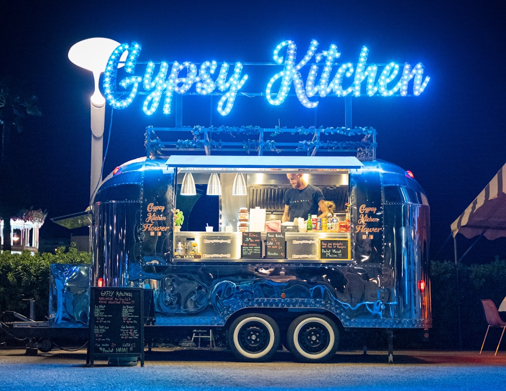 a food truck parked in front of a restaurant