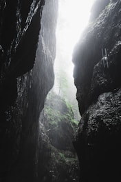 a person standing in the middle of a cave