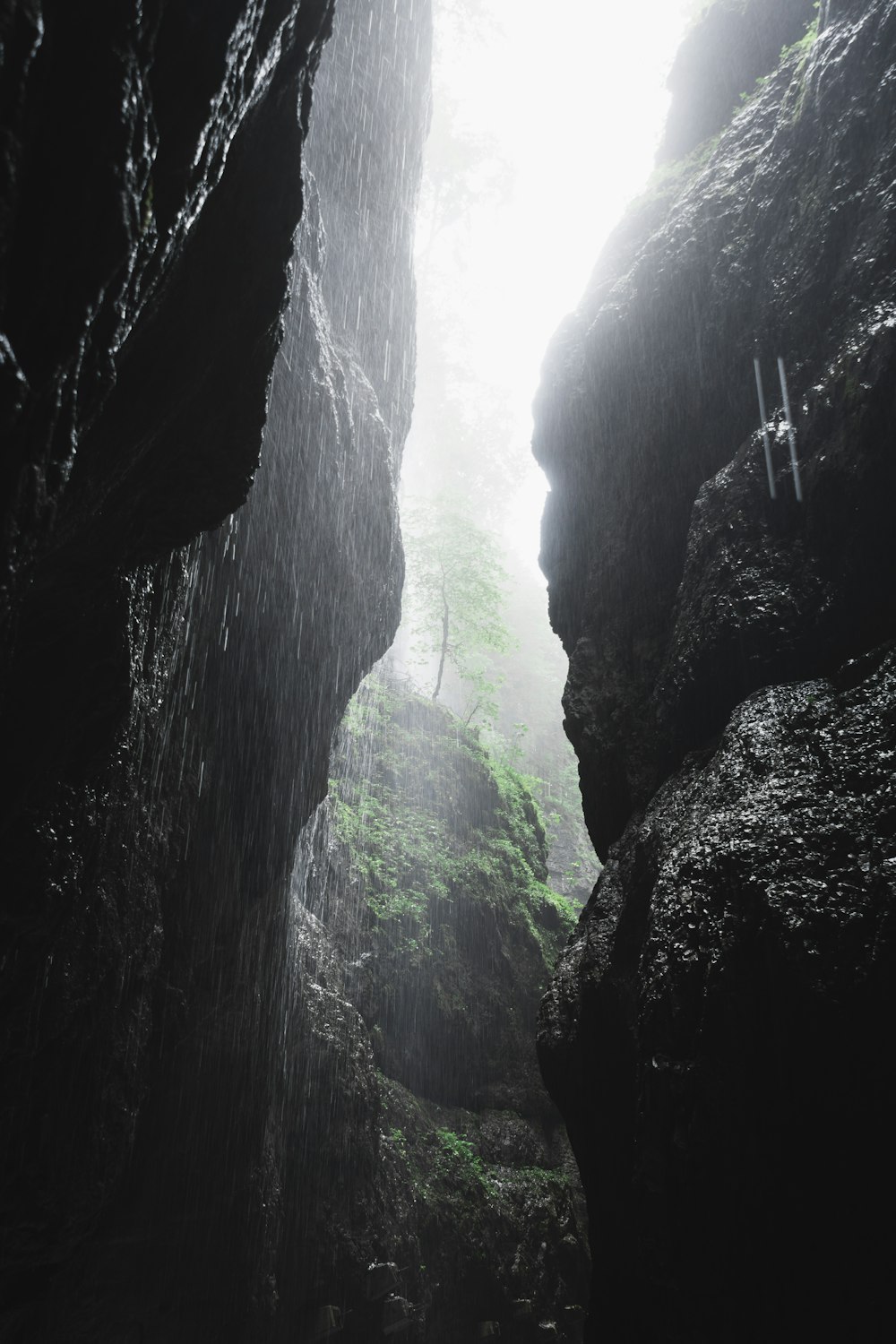a person standing in the middle of a cave