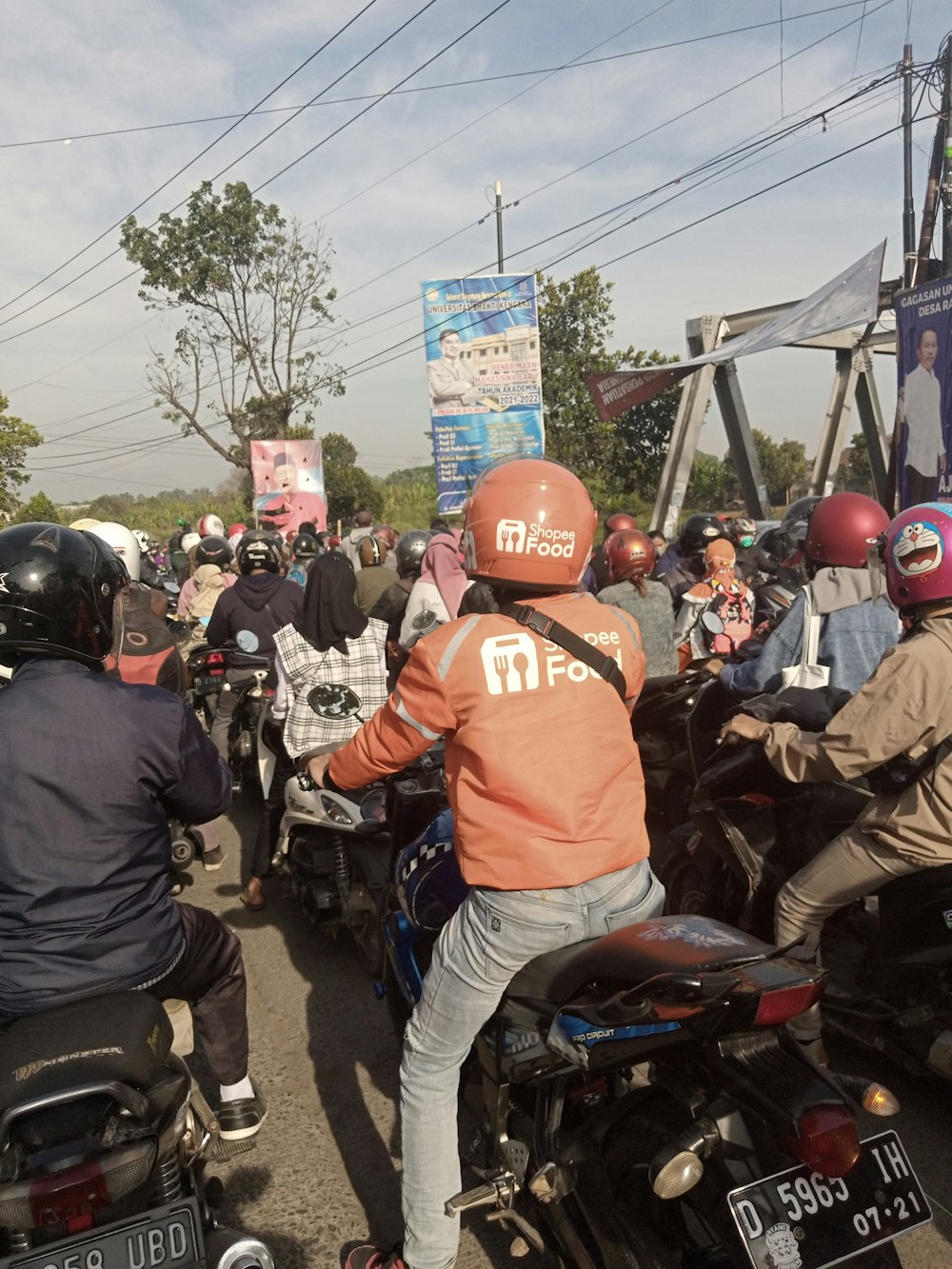 a group of people riding motorcycles down a street