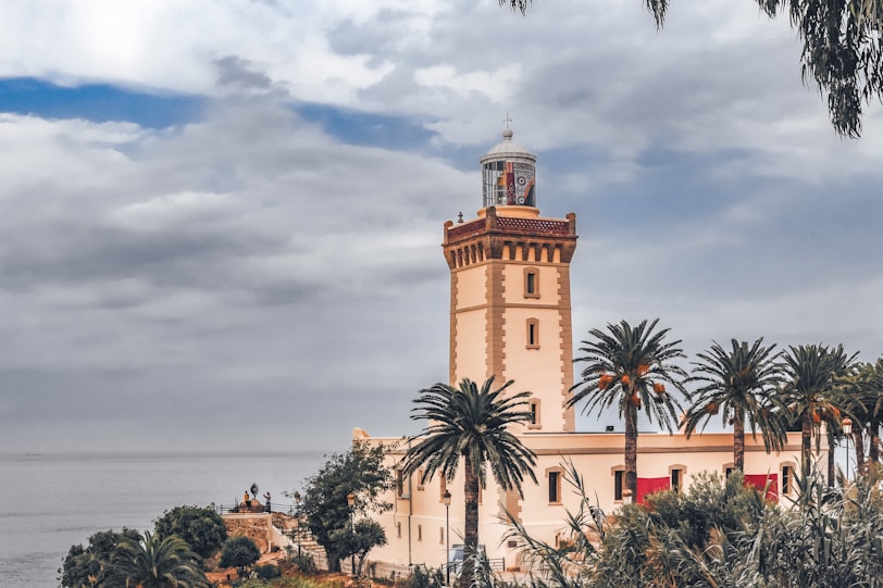 The Literary Titans of Tangier a tall tower with a clock on top of it