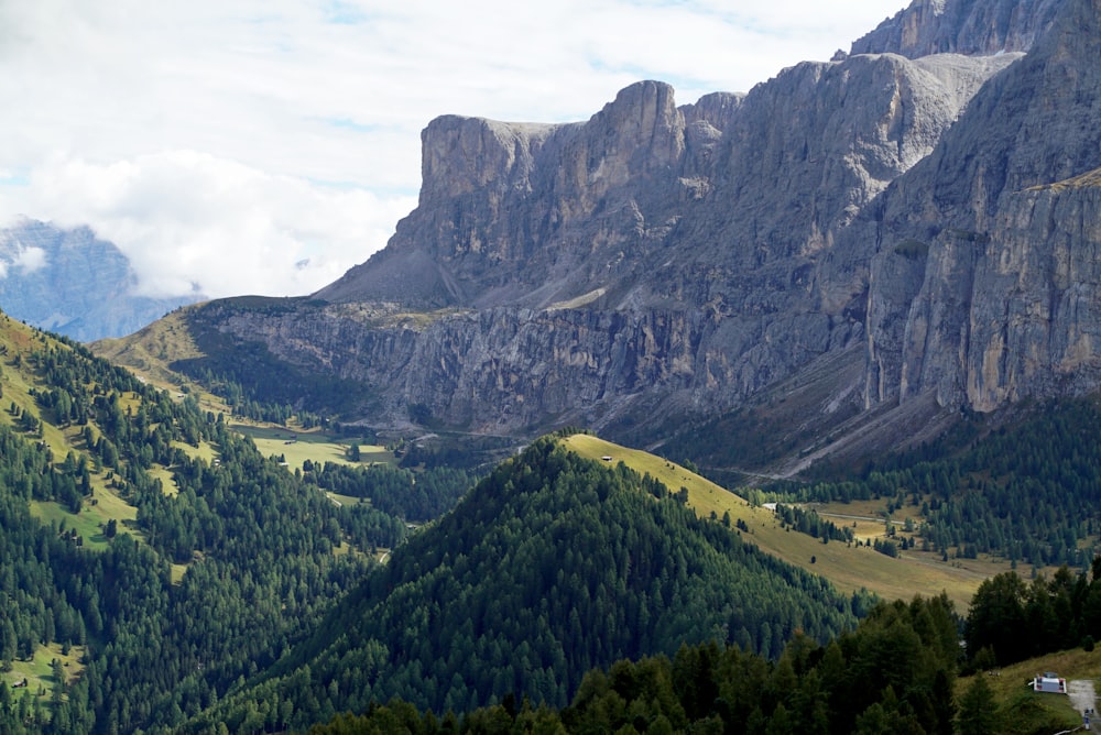 a mountain range with a valley in the foreground